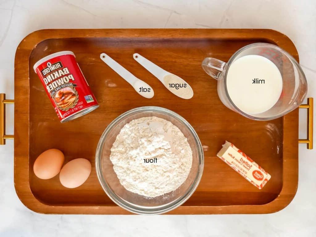 Ingredients: flour, sugar, butter, milk, eggs, baking powder, and salt.