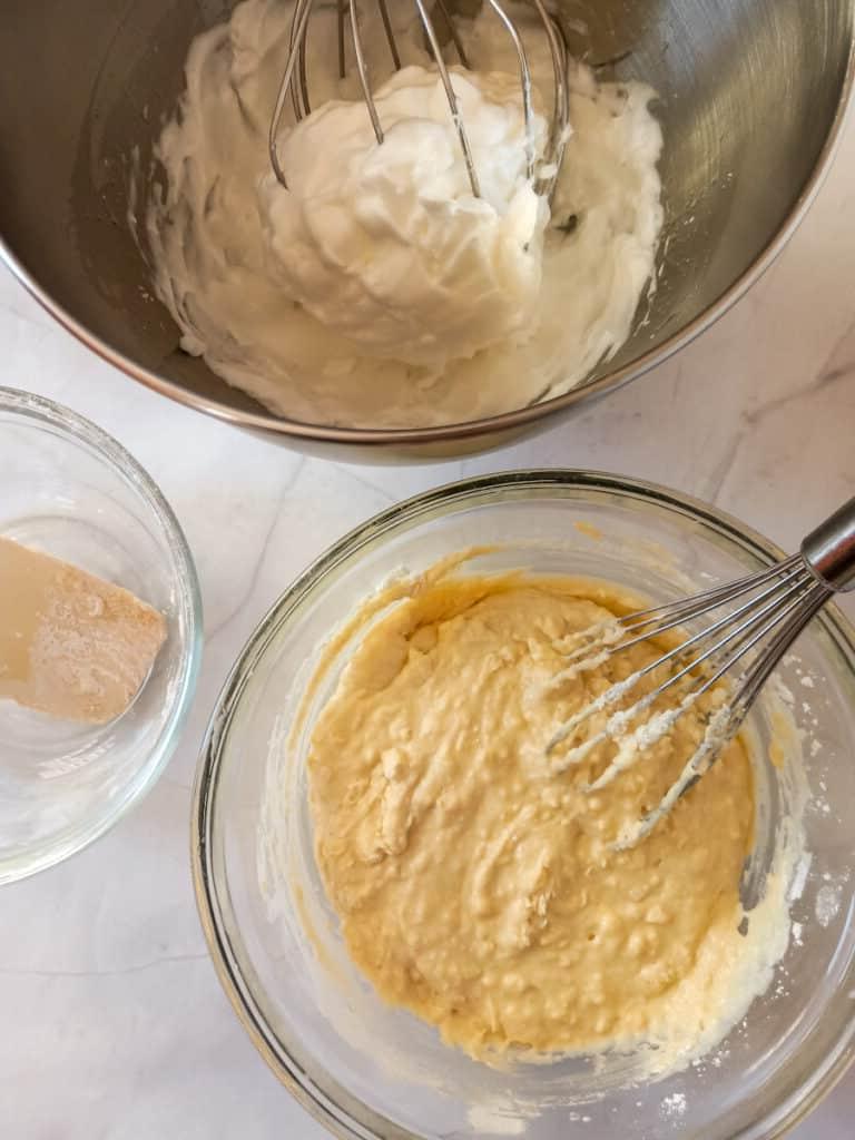 Bowl with whipped egg whites and the remaining batter.