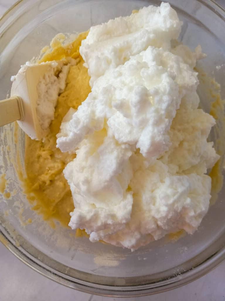 folding egg whites into the batter.