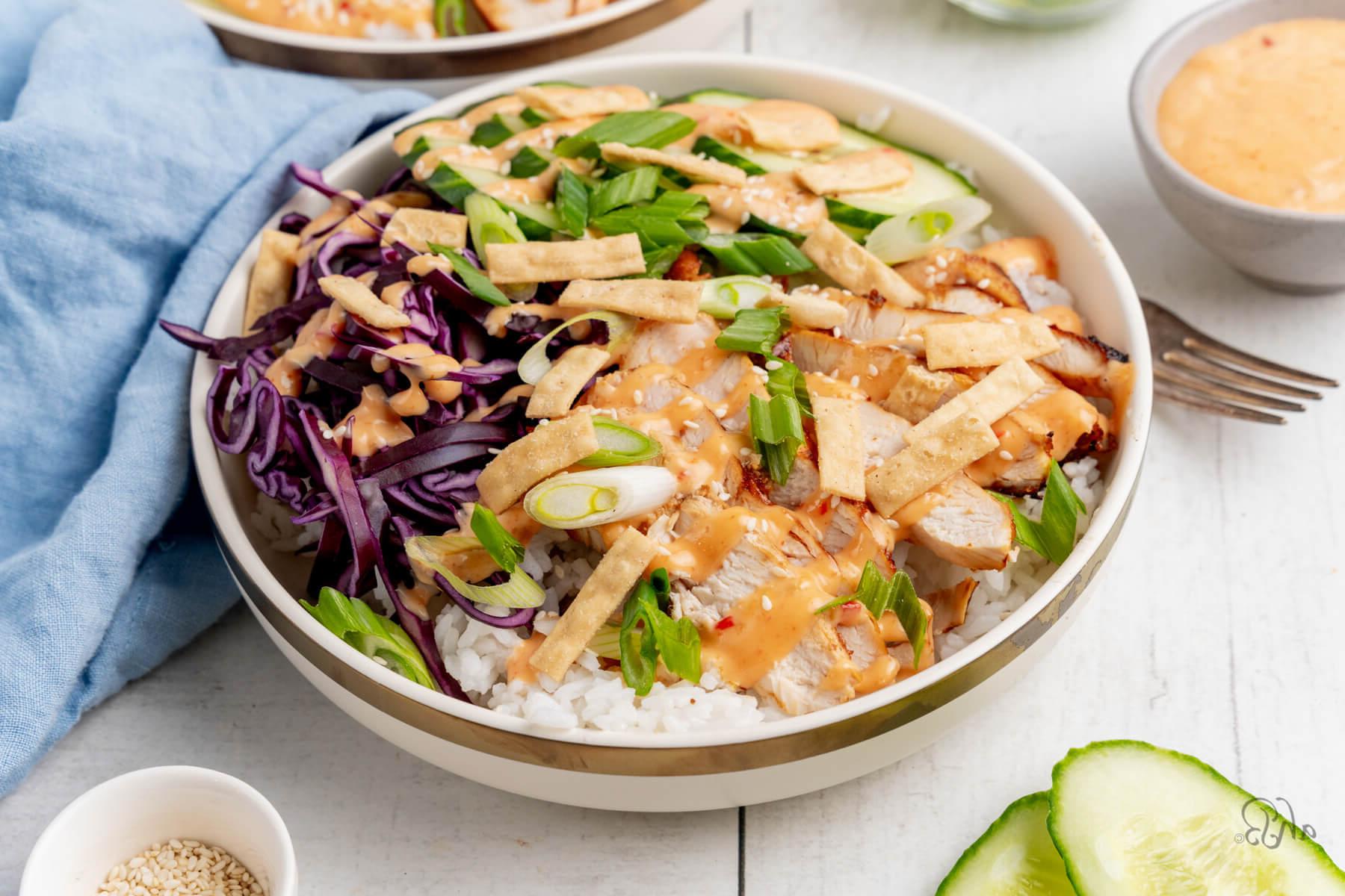 A white bowl of a serving of Bang bang chicken.