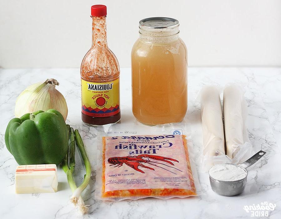 crawfish pie ingredients inclduing flour, pie crusts, stock, hot suace, green onion, butter, green bell pepper and onion
