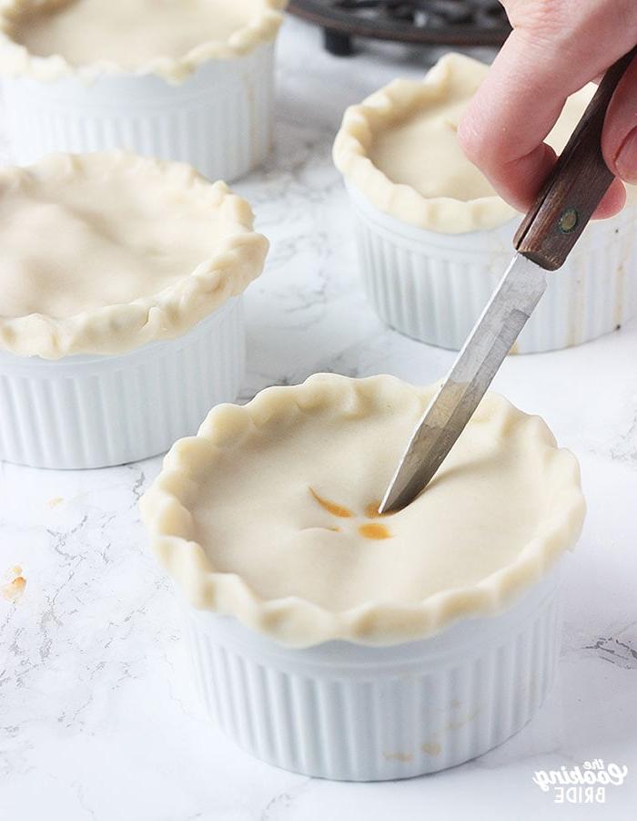cutting slits into the top of an unbaked pie shell