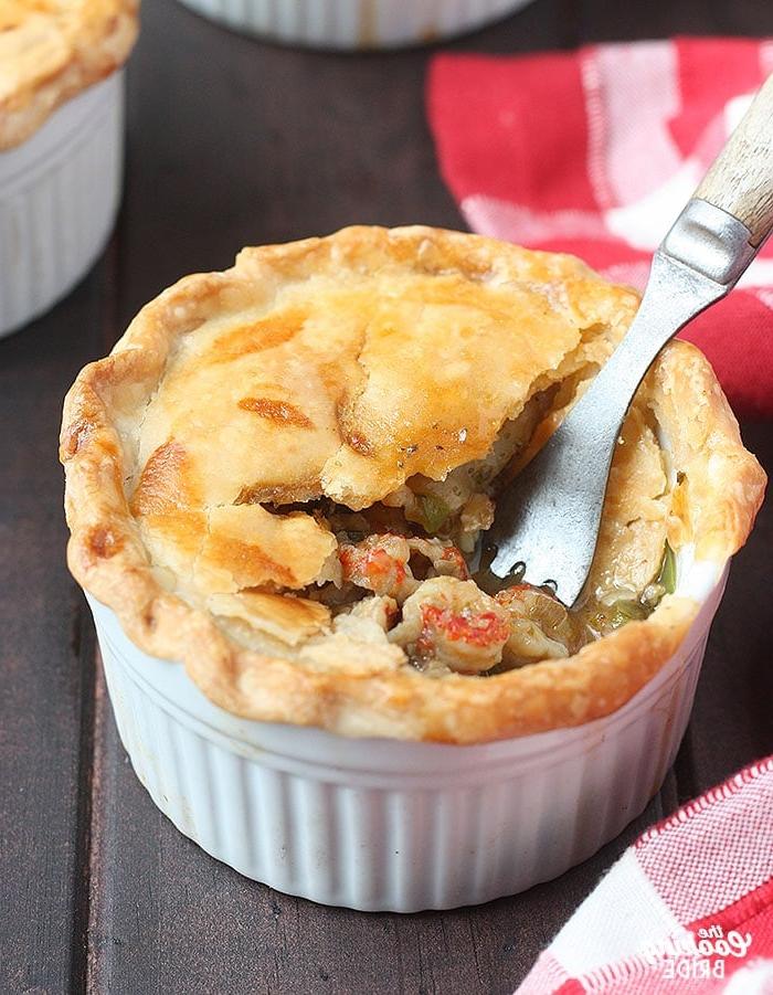 metal fork taking a bite out of a baked crawfish pie