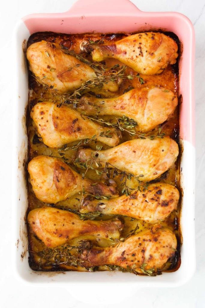 Baked Chicken Legs in a baking dish straight out of the oven