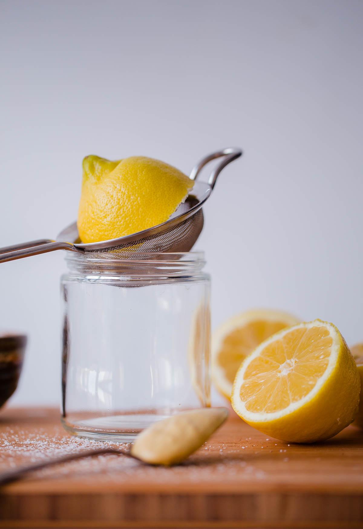 Lemon Juice Being Squeezed into a jar